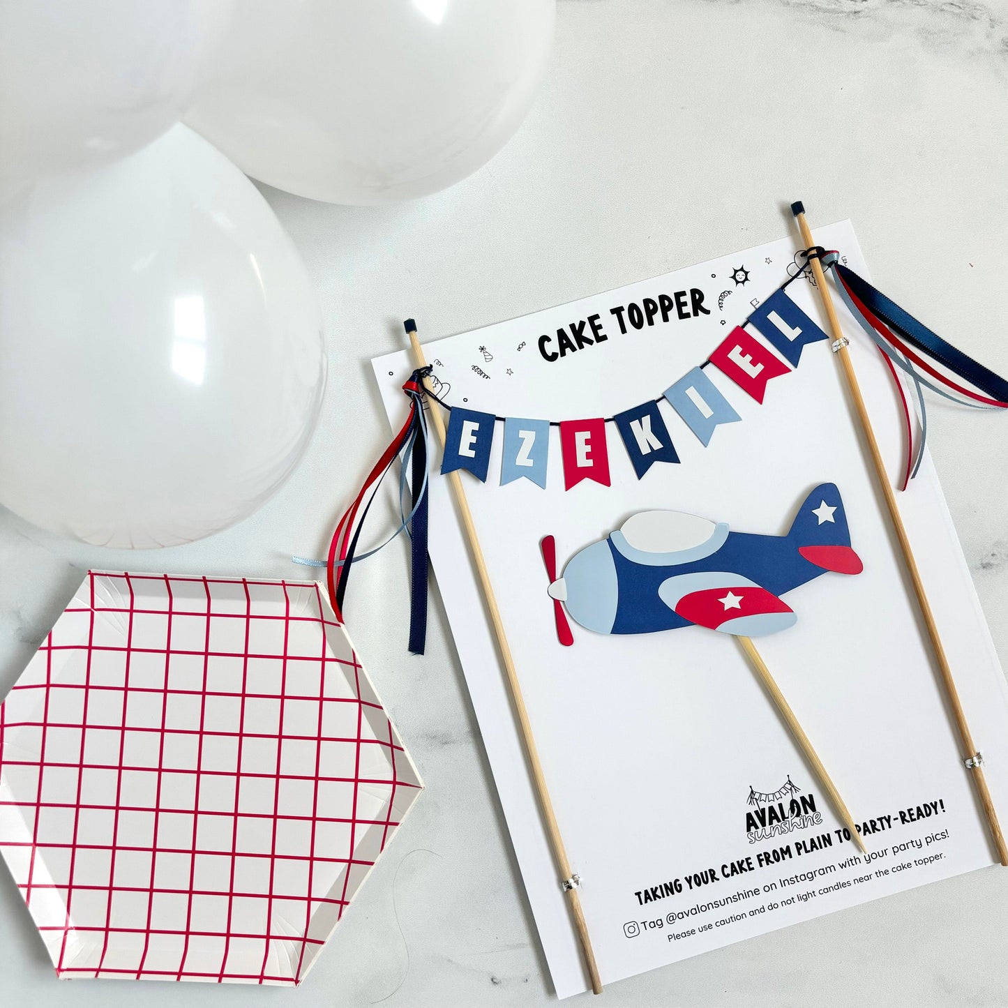 2 piece cake topper set for airplane theme birthday party.  Personalized name banner in shades of blue and red with an airplane to go under the banner | personalized cake toppers by Avalon Sunshine