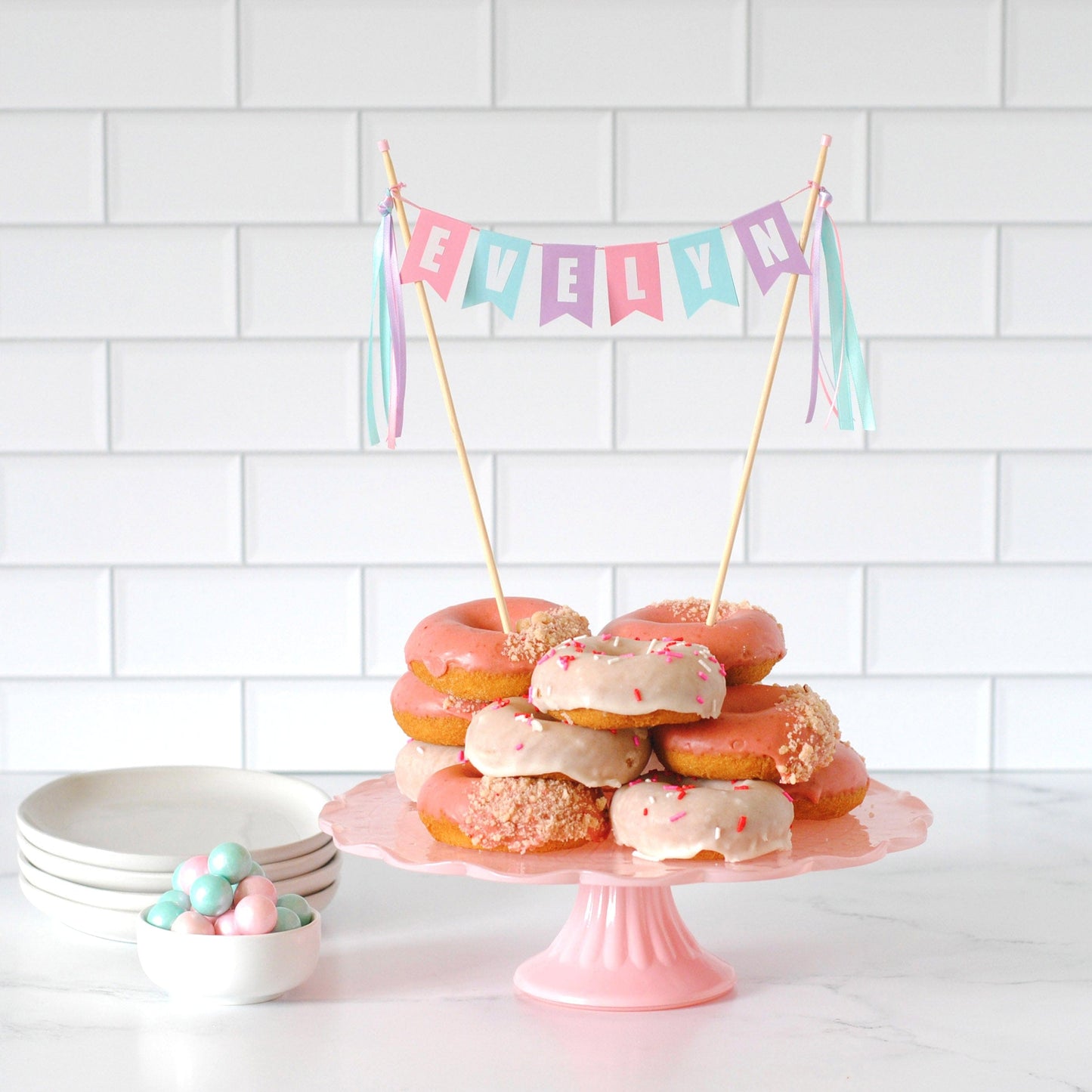 Donuts on a cake stand with personalized birthday cake topper | personalized cake toppers by Avalon Sunshine