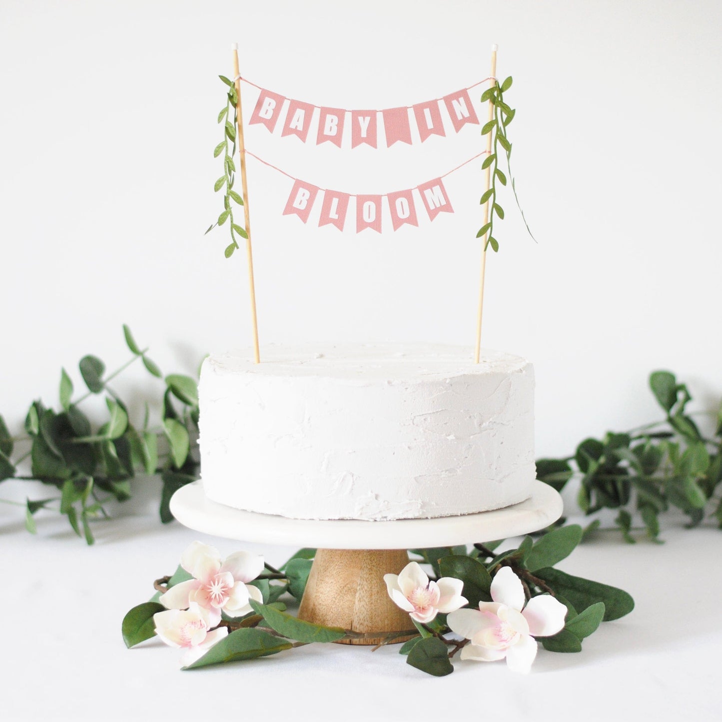 baby in bloom cake topper - two tiered dusty rose pink paper flags with leafy ribbon tassels
