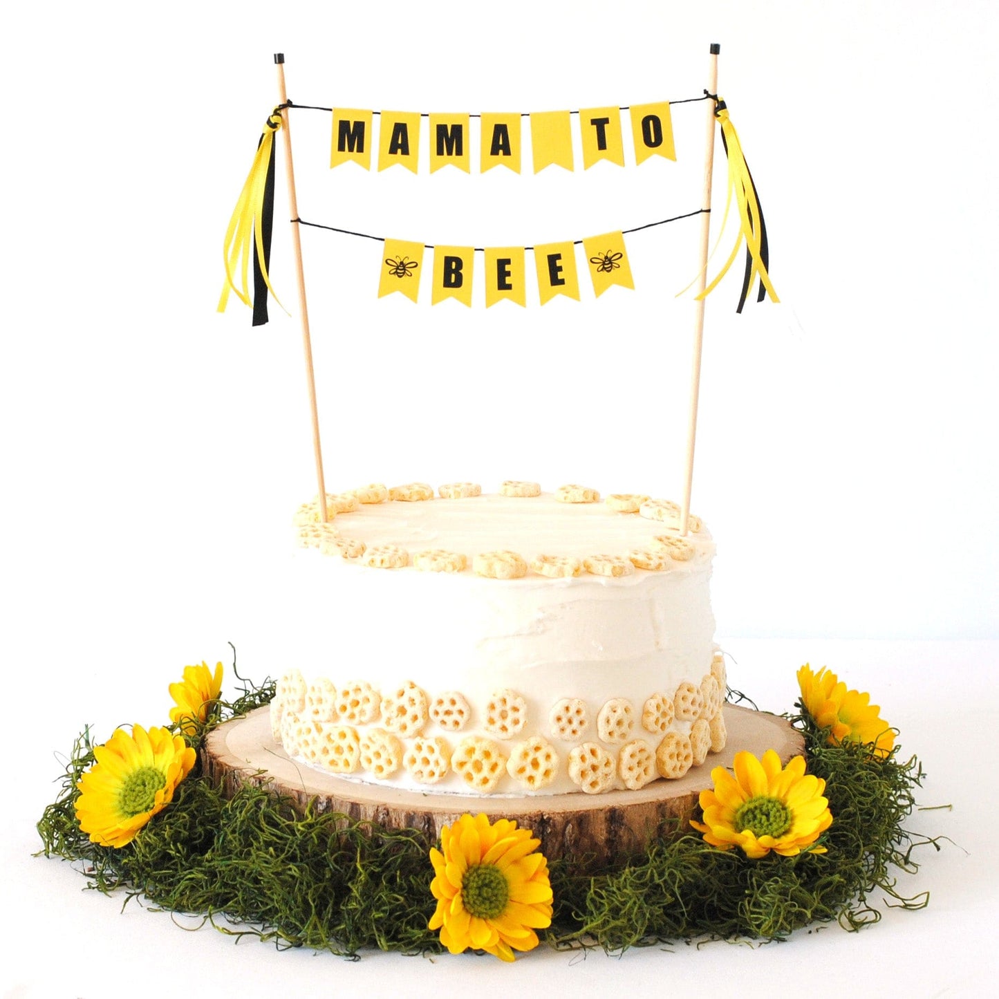 yellow and black "mama to bee" cake topper for bee themed baby shower.
