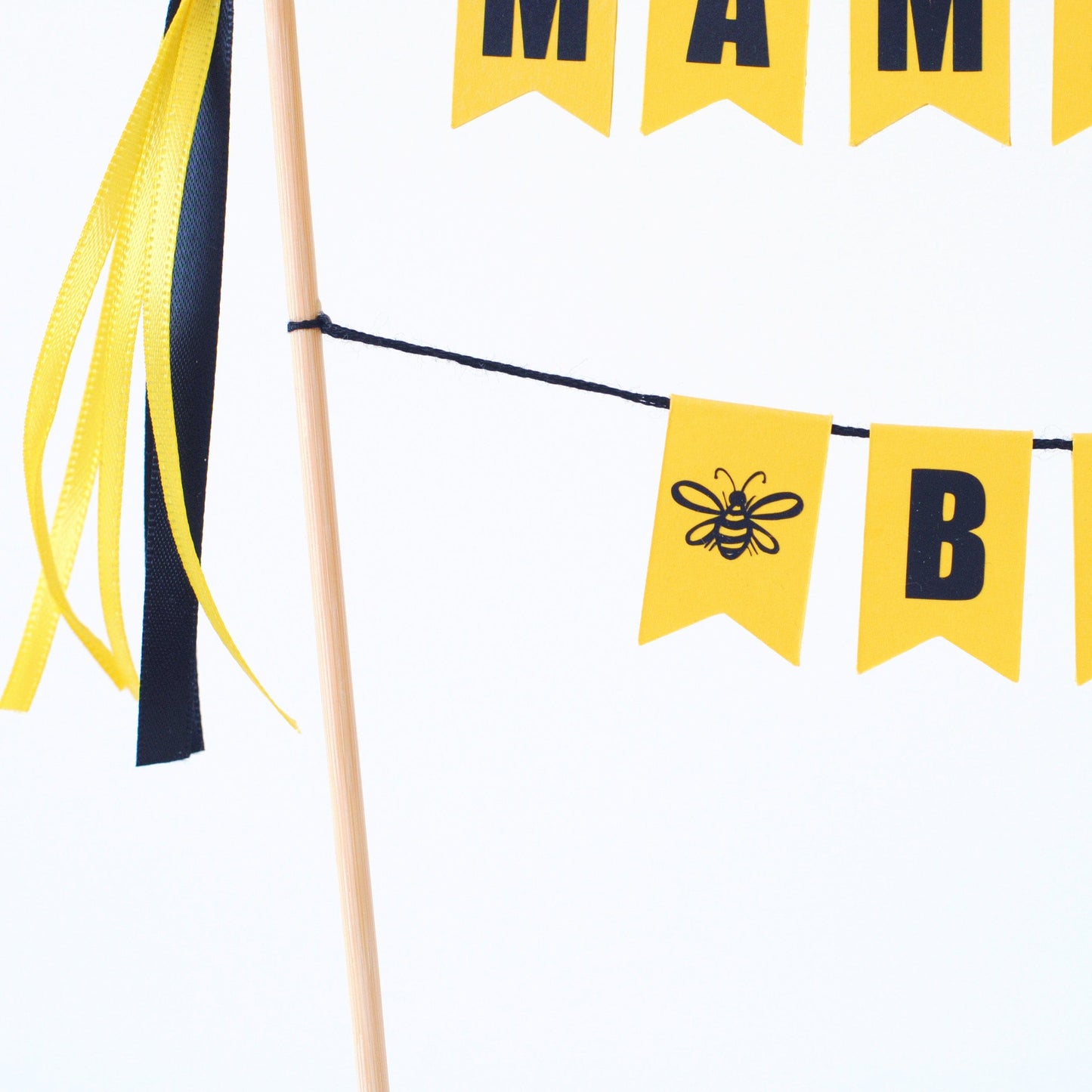 close-up of a bee as part of a bee themed baby shower cake topper