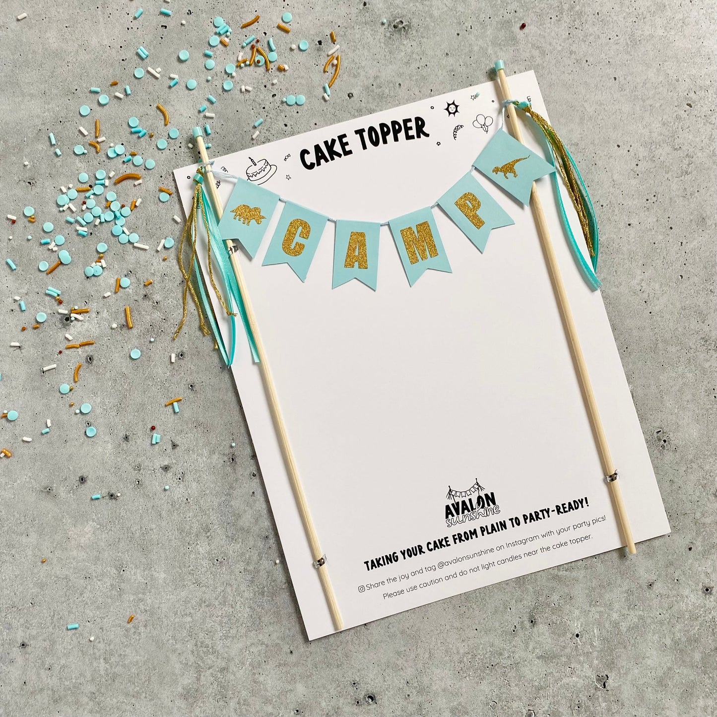 light aqua and gold cake topper for dinosaur theme birthday