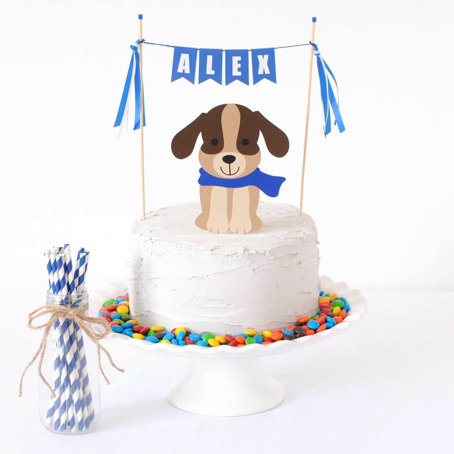 dog theme birthday party cake topper set with brown dog wearing a blue scarf and a blue personalized name banner