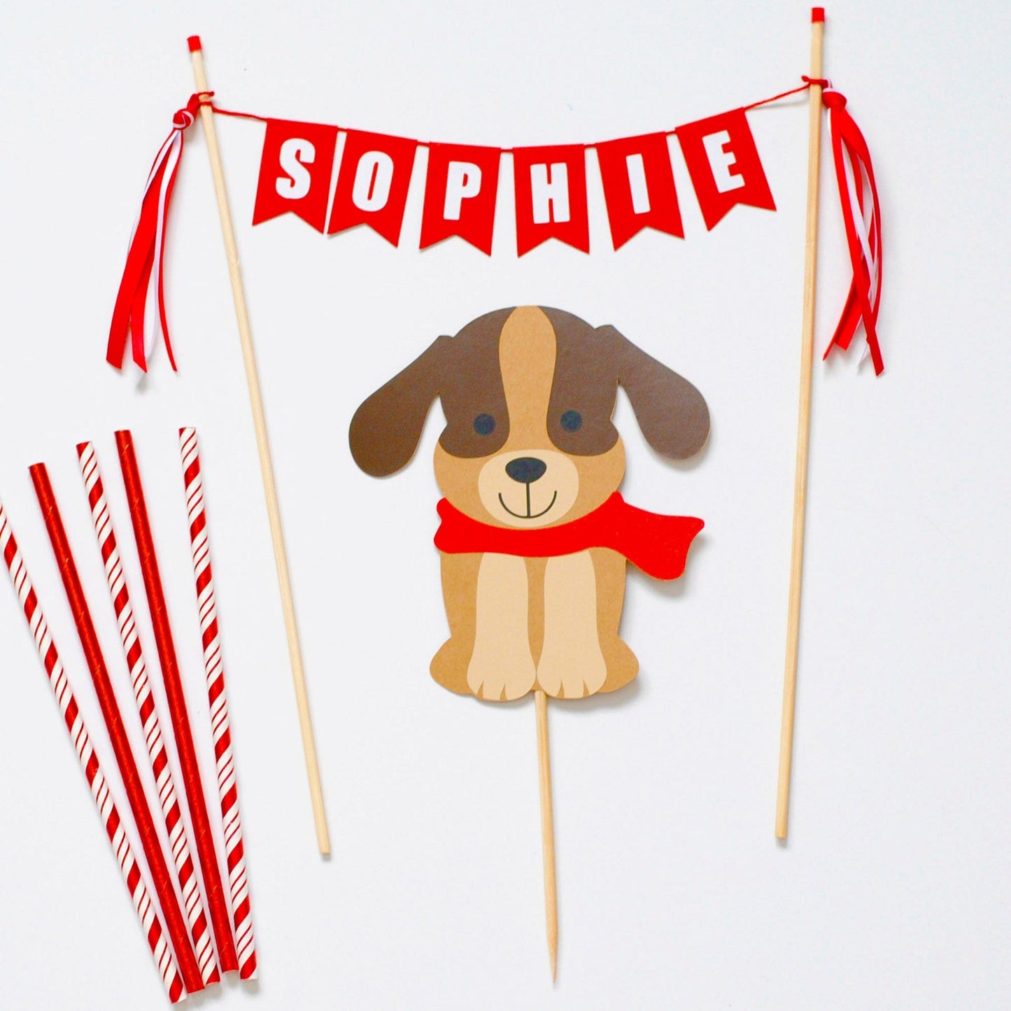 cake topper set with brown dog wearing a red scarf and a red personalized name banner for dog theme birthday party