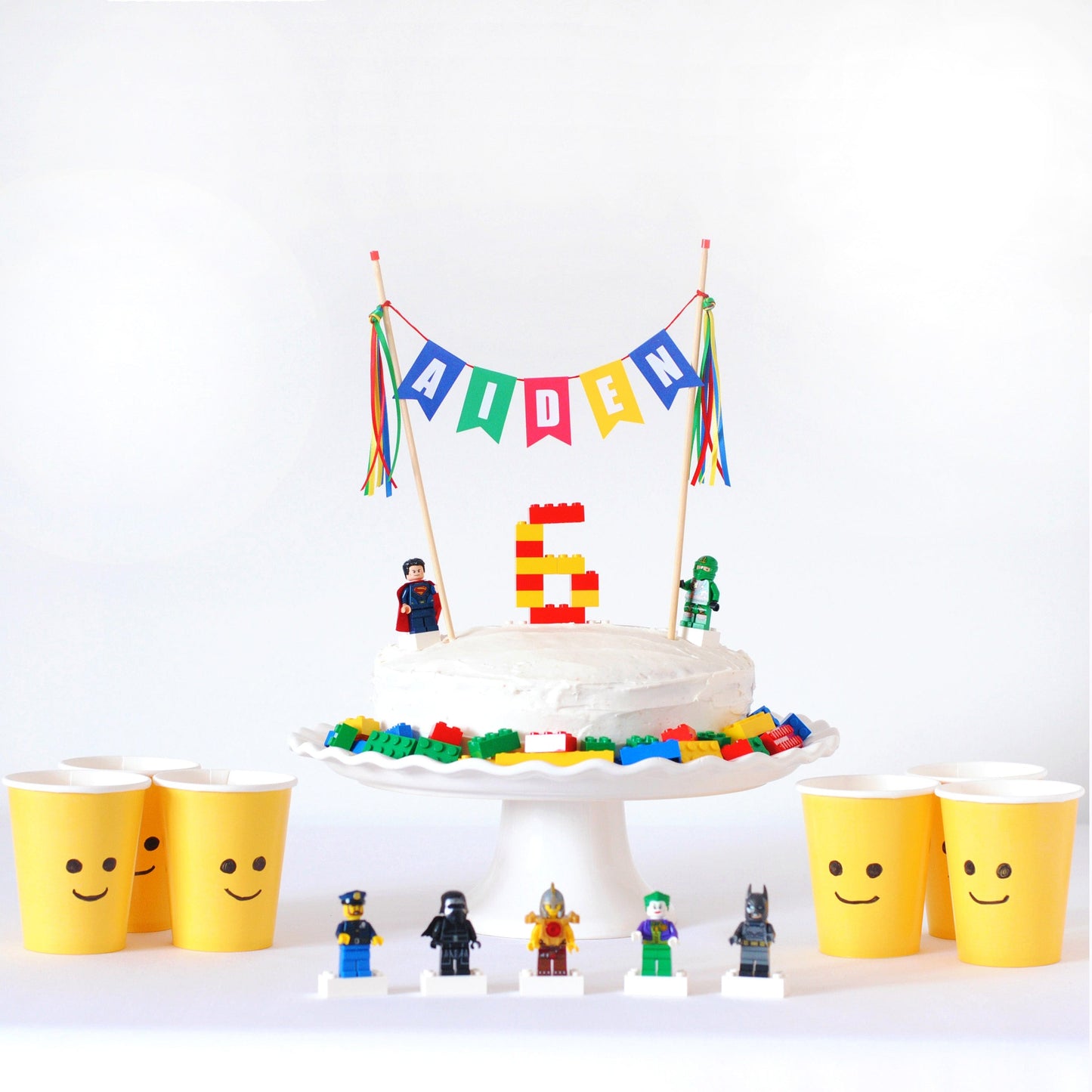 lego colors birthday cake topper with lego minifigure paper cups