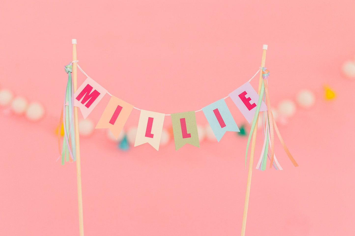 girls personalized birthday cake topper in pastel rainbow colors