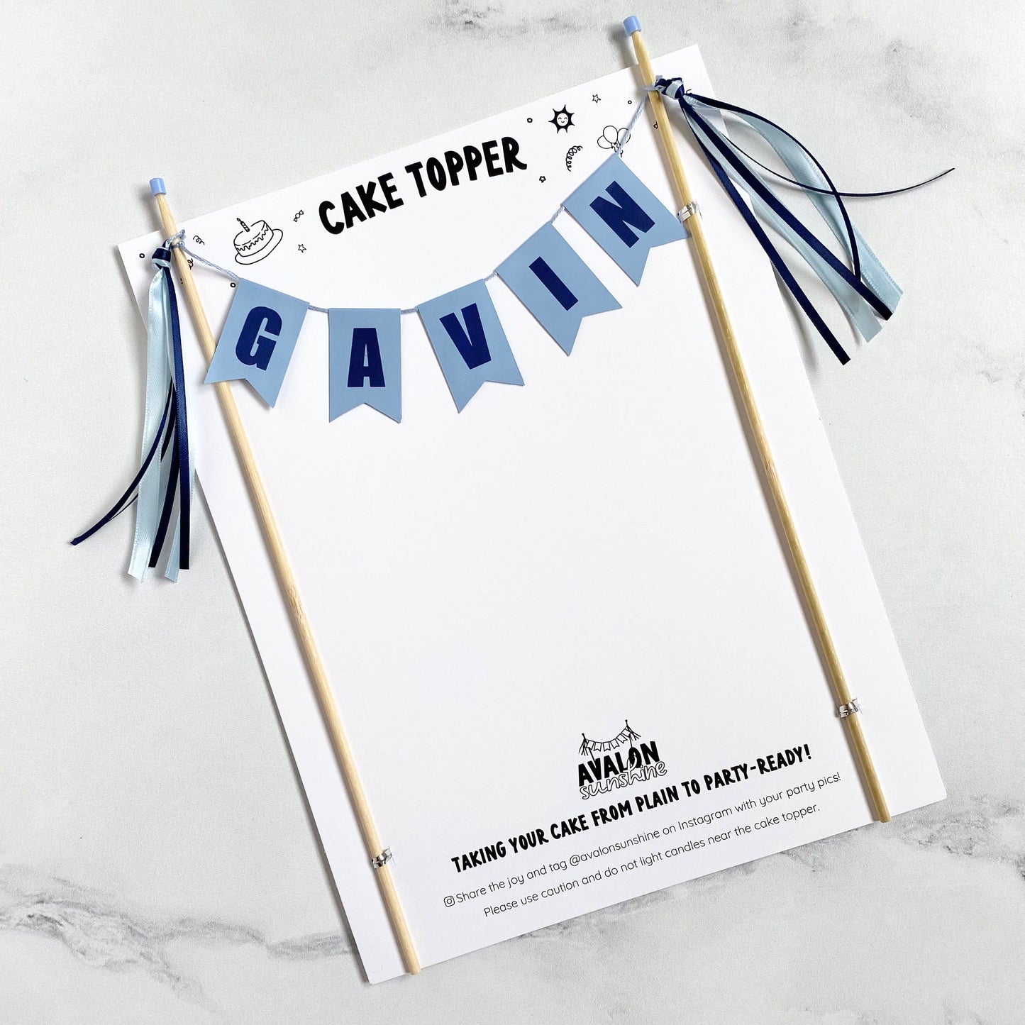 personalized name cake topper light blue and dark blue with matching ribbon tassels