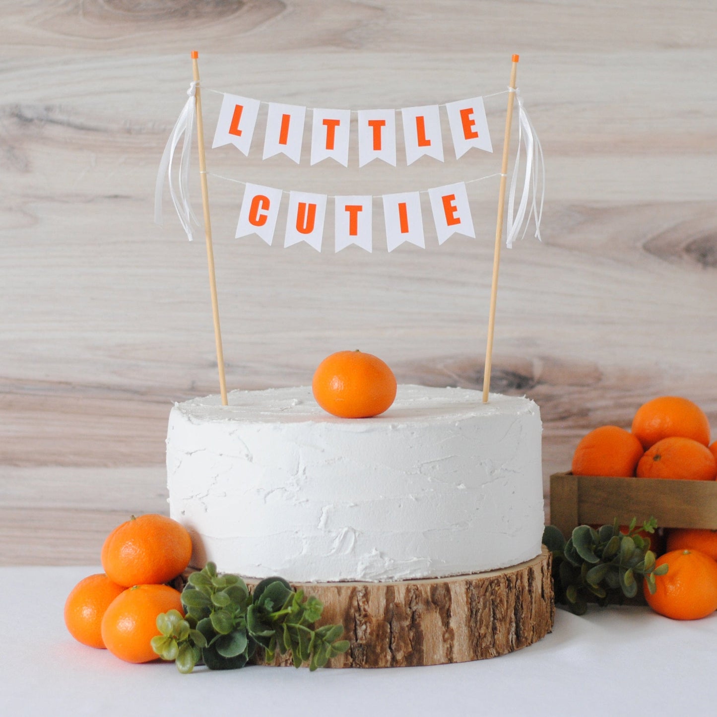 little cutie cake topper with white ribbons for baby shower or birthday party