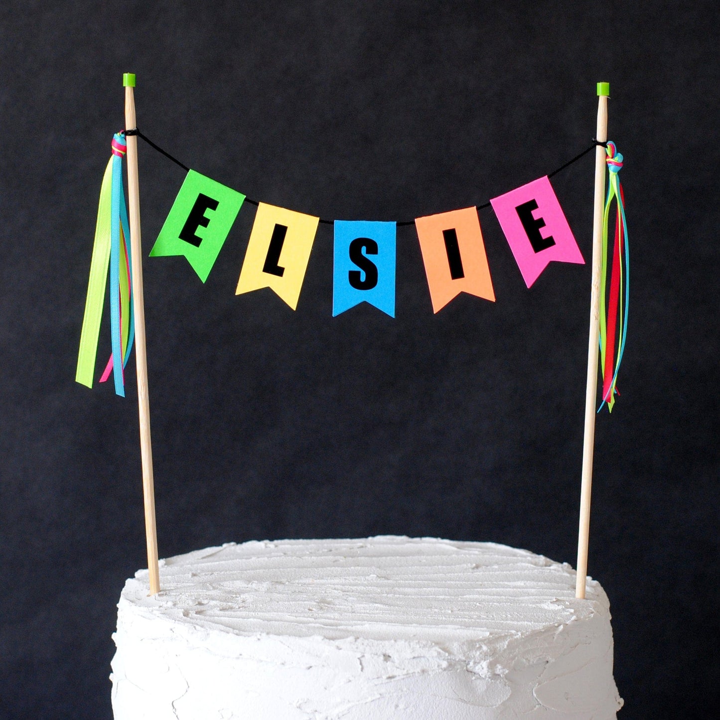 kids birthday cake topper in bright neon colors personalized with first name