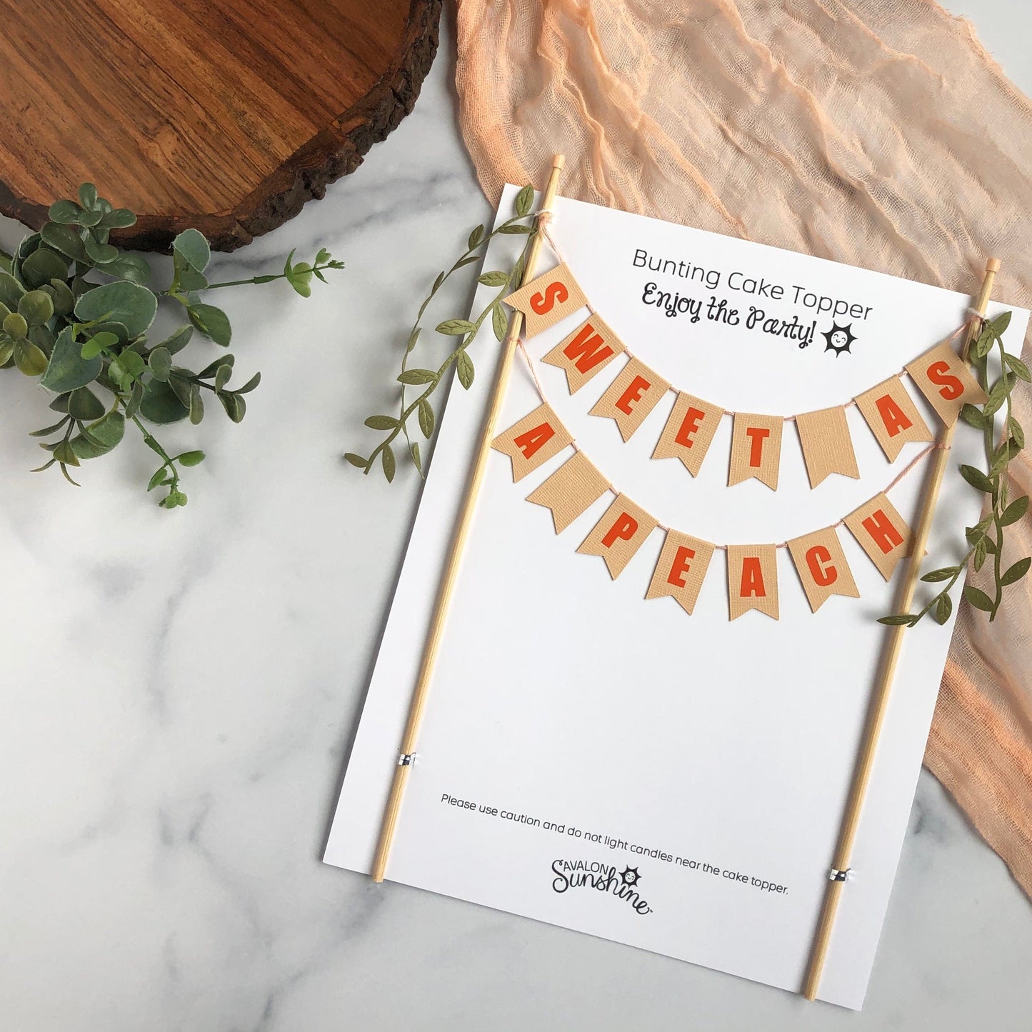 Sweet as a Peach Baby Shower Cake Topper with greenery ribbons