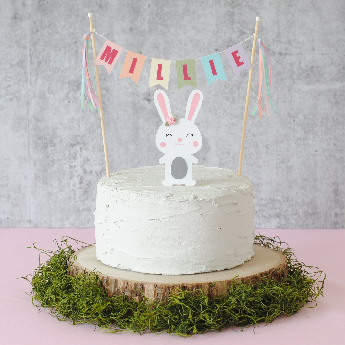 bunny cake topper with pastel name banner