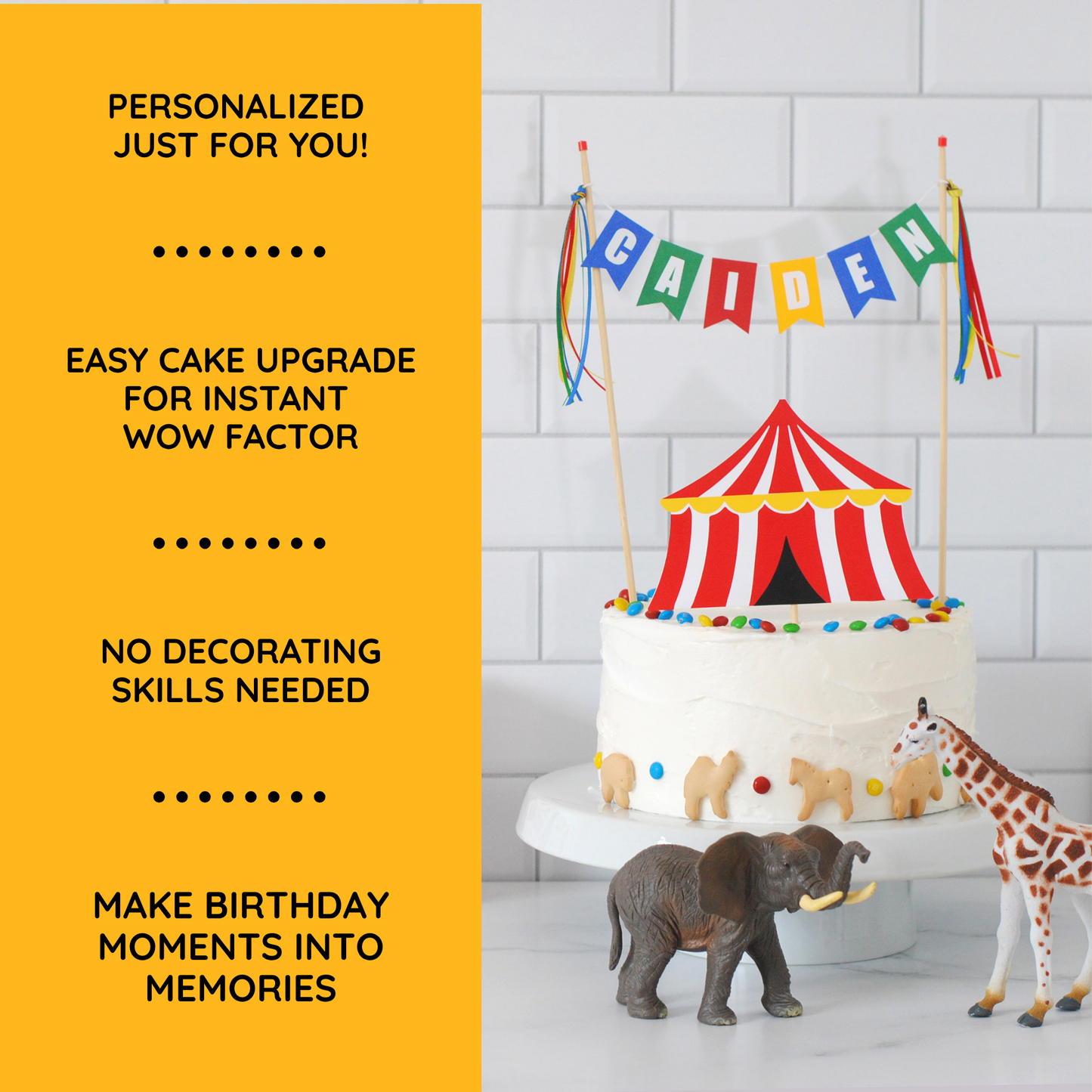 
                  
                    A birthday cake topper setup in a kitchen-like setting with a white tiled wall. The product shown is a white frosted cake decorated with a red-and-white striped circus tent topper, colorful round accents, and a multicolor 'CAIDEN' name banner on sticks.
                  
                