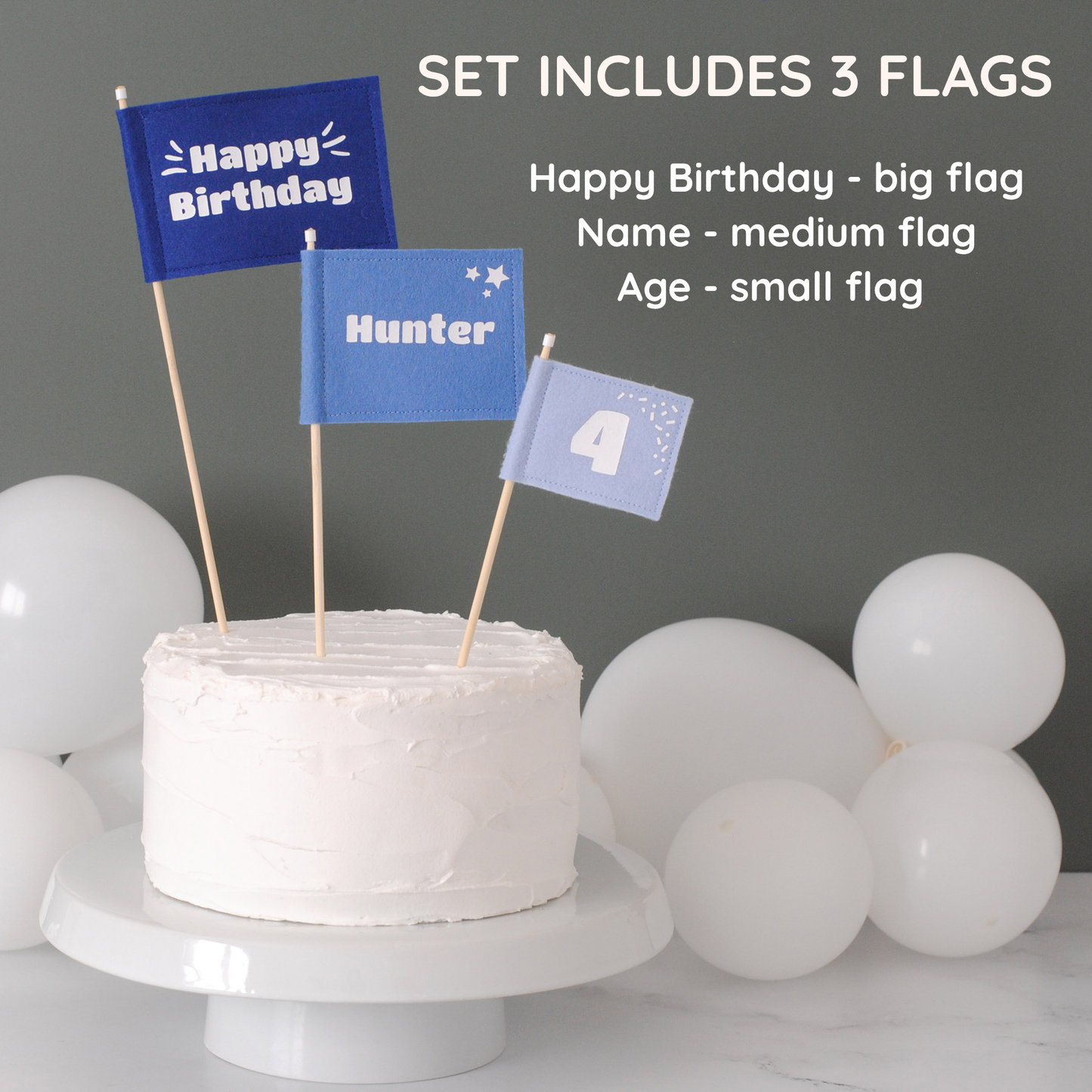 
                  
                    Set of 3 felt flag cake toppers in shades of blue. Large flag with HAPPY BIRTHDAY, medium flag personalized with name HUNTER, and small flag with age 6. 
                  
                