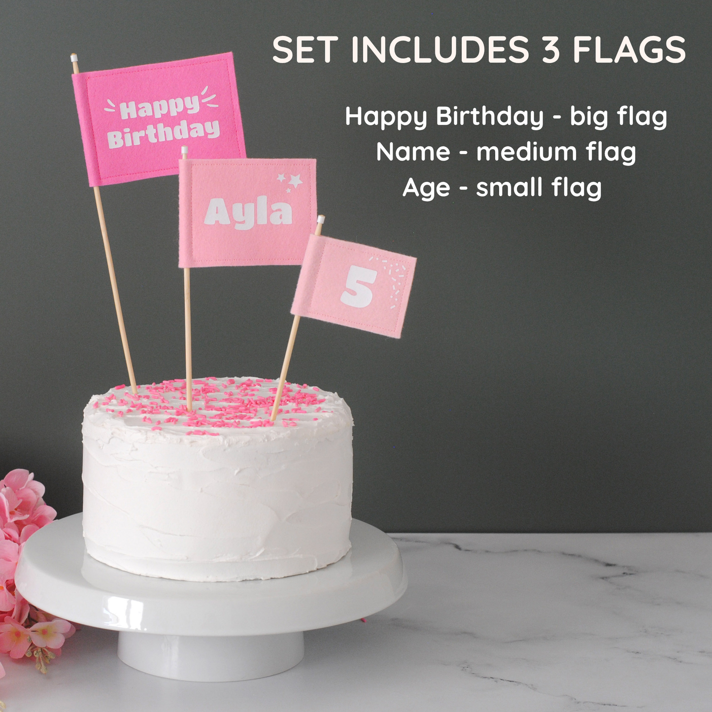 
                  
                    Set of 3 Felt Flag cake topper flags in varying shades of pink.  Big flag has HAPPY BIRTHDAY. Medium flag is personalized with Name: AYLA.  Small flag is personalized with age 5. 
                  
                
