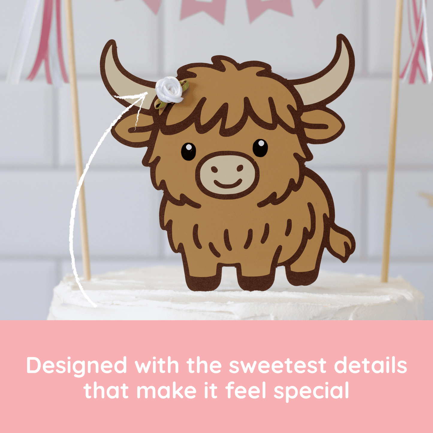 
                  
                    A  Highland cow cake topper with brown fur, cream horns, and a small white flower on its head, shown on a white frosted cake. Pink banner decorations are blurred in the background, and a pink text banner at the bottom reads, 'Designed with the sweetest details that make it feel special'.
                  
                