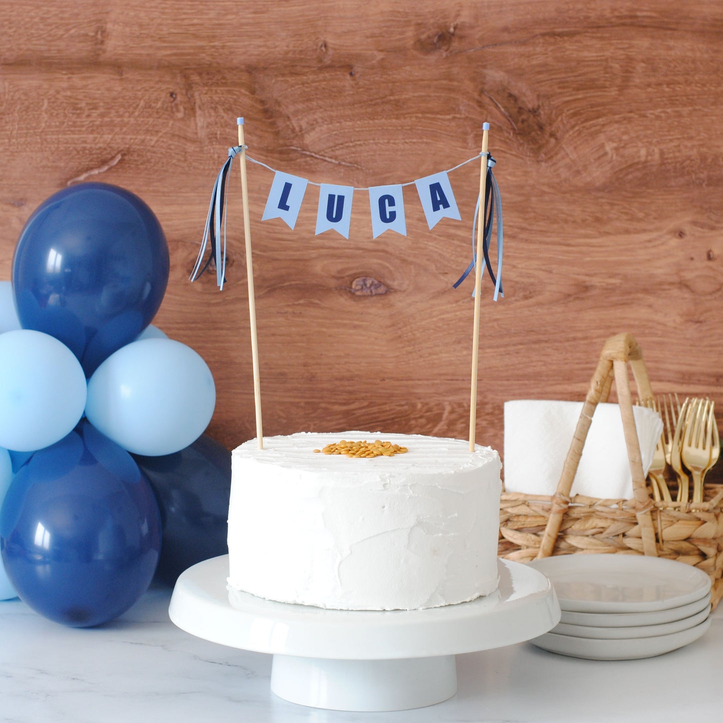 
                  
                    kids birthday cake topper personalized with name in navy blue and light blue letters
                  
                