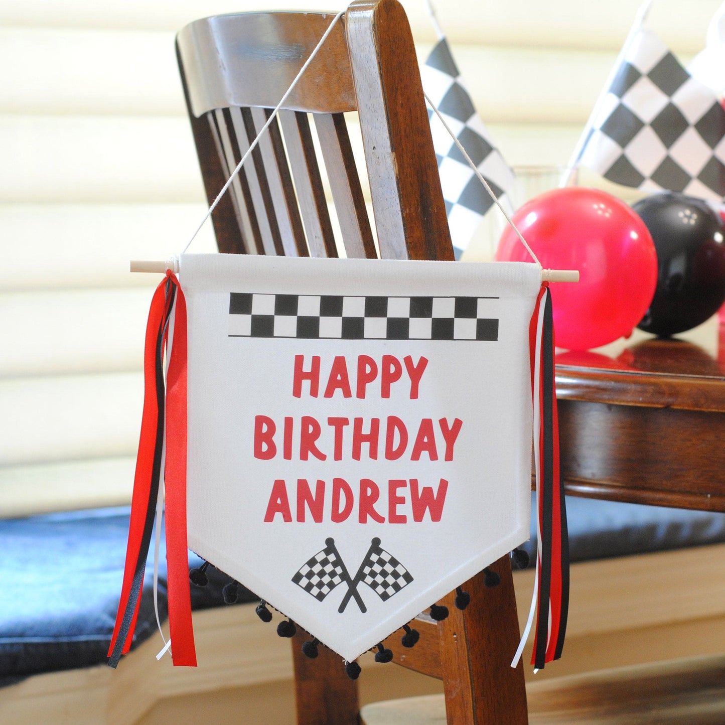 Small canvas birthday banner with pom pom fringe and race car theme personalized with HAPPY BIRTHDAY ANDREW