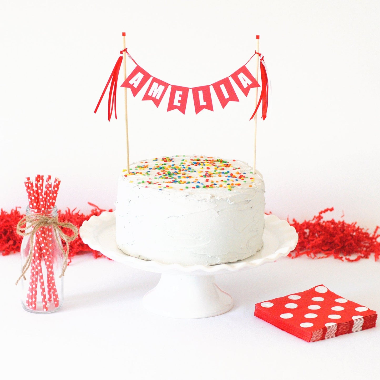 
                  
                    personalized name cake topper for boys birthday or girls birthday cake shown in red with white letters
                  
                