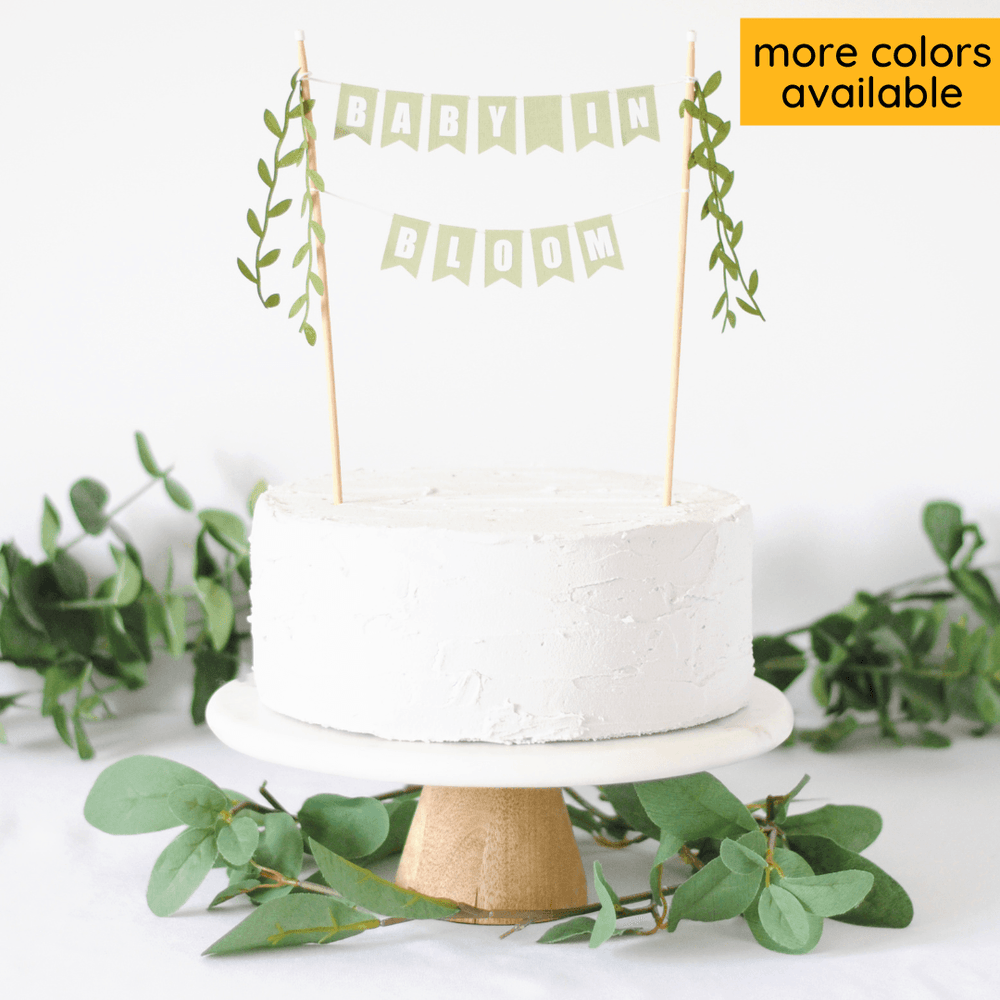 baby in bloom cake topper - two tiered sage green paper flags with leafy ribbon tassels