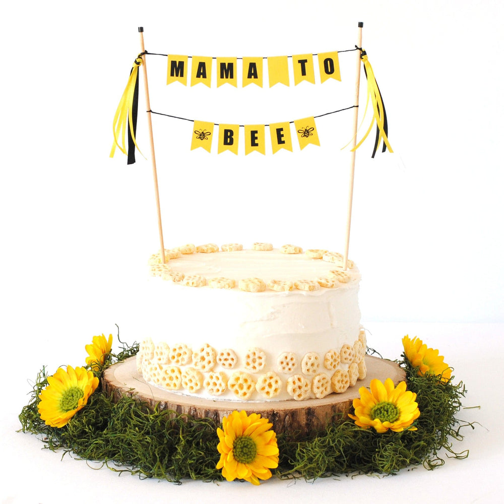 yellow and black "mama to bee" cake topper for bee themed baby shower.  