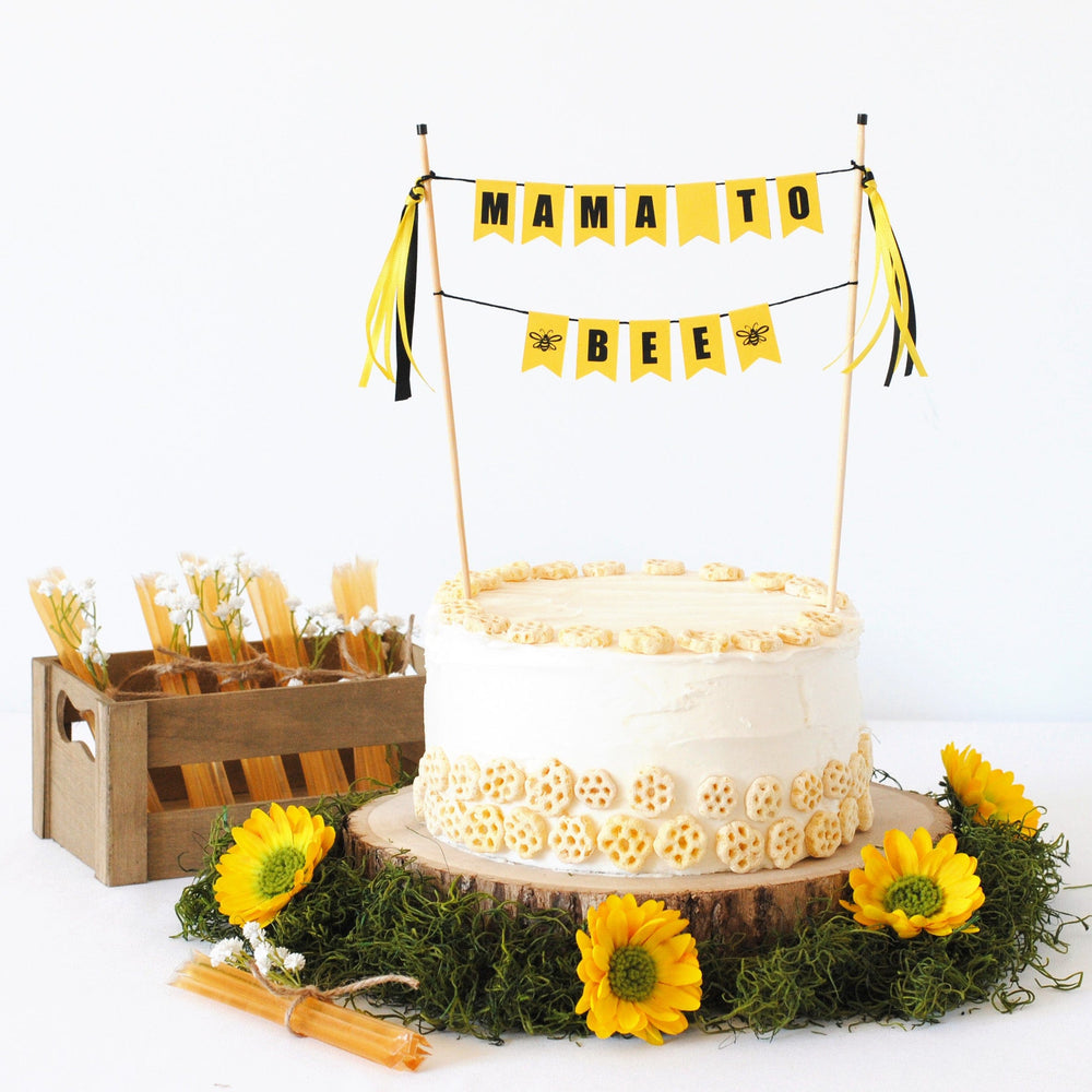 
                  
                    bee themed baby shower cake topper with wording "mama to bee"
                  
                