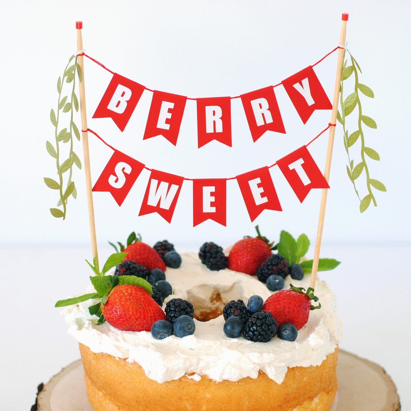 
                  
                    berry sweet cake topper on angel food cake with fresh berries
                  
                
