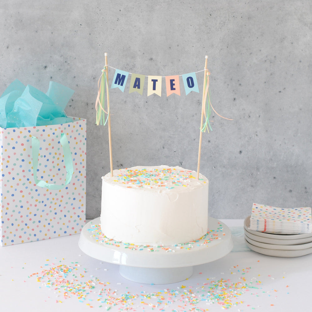 pastel birthday cake topper for boys personalized with dark blue letters