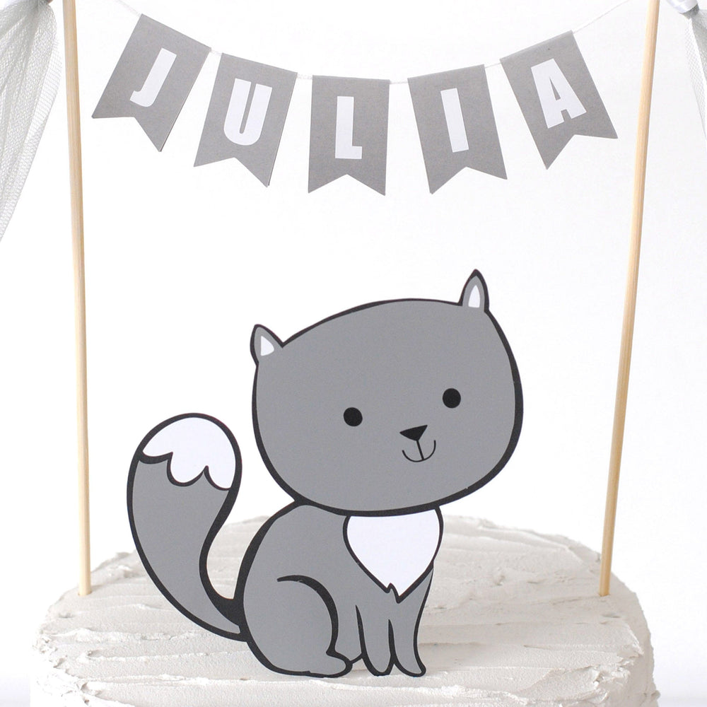 
                  
                    close-up of grey cat cake topper and name cake banner for cat theme birthday cake
                  
                