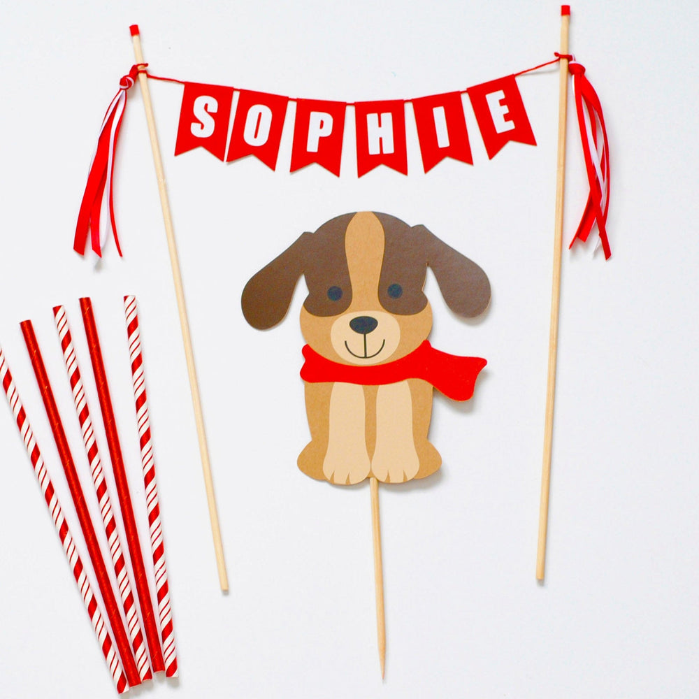 
                  
                    cake topper set with brown dog wearing a red scarf and a red personalized name banner for dog theme birthday party
                  
                