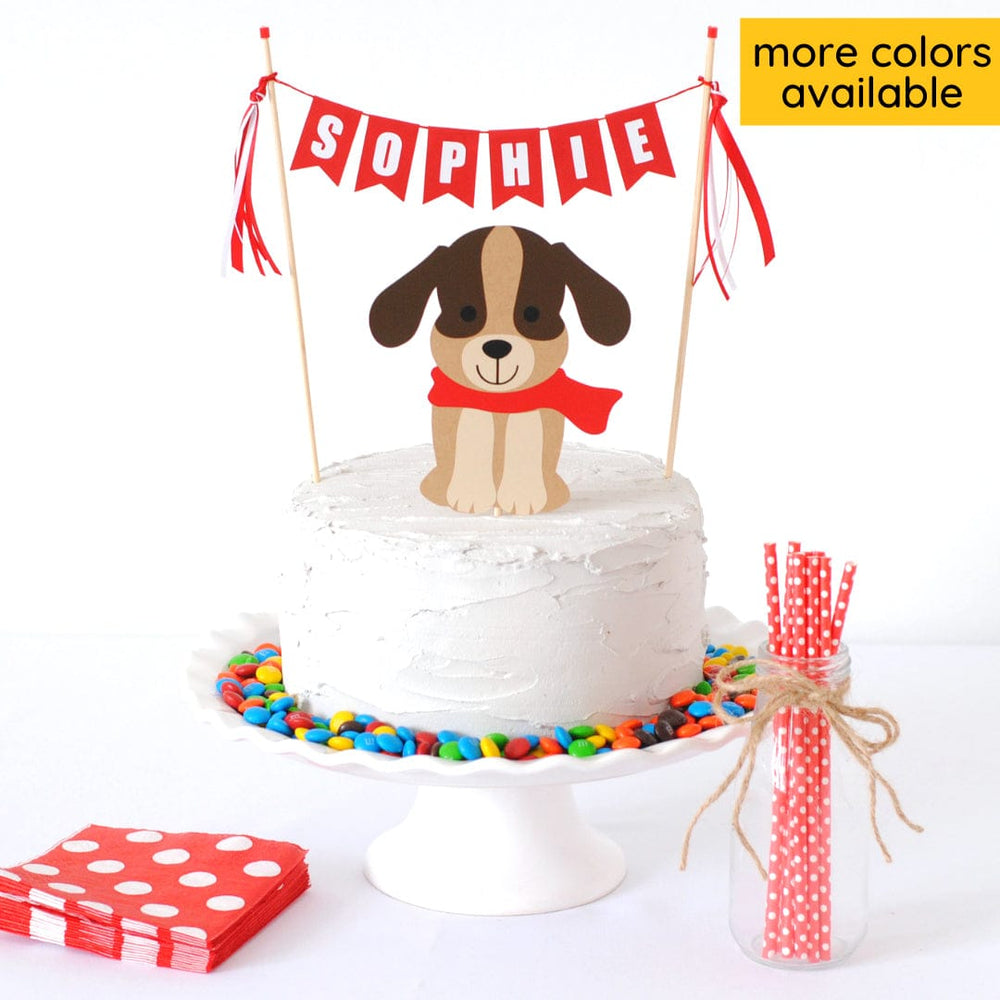 cake topper set with brown dog wearing a red scarf and a red personalized name banner for dog theme birthday party