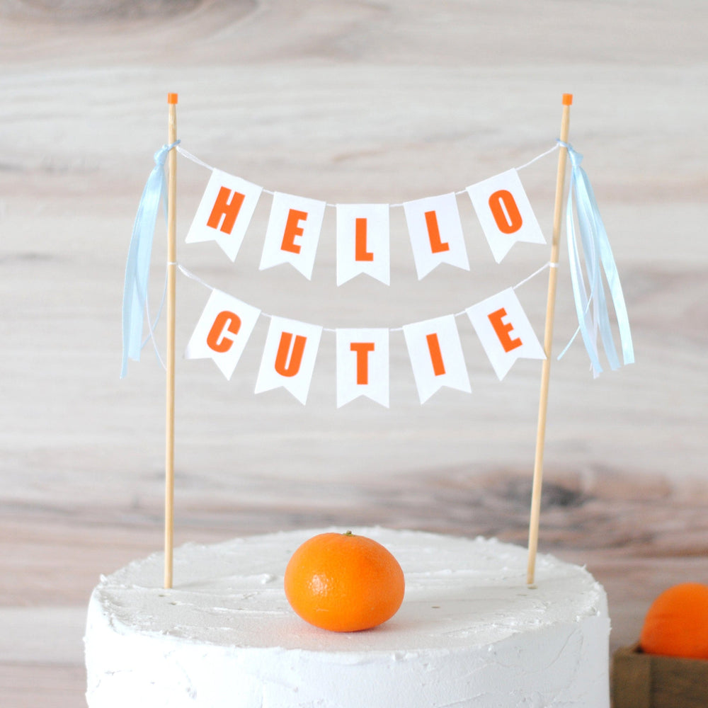 
                  
                    Hello cutie baby shower cake topper for boy baby shower with blue ribbons
                  
                