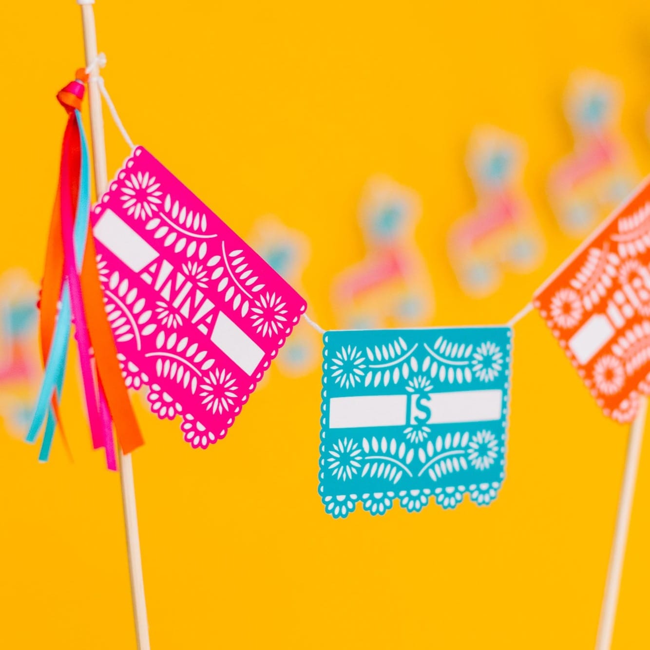 
                  
                    Mexican fiesta papel picado cake topper personalized for a fiesta theme birthday
                  
                