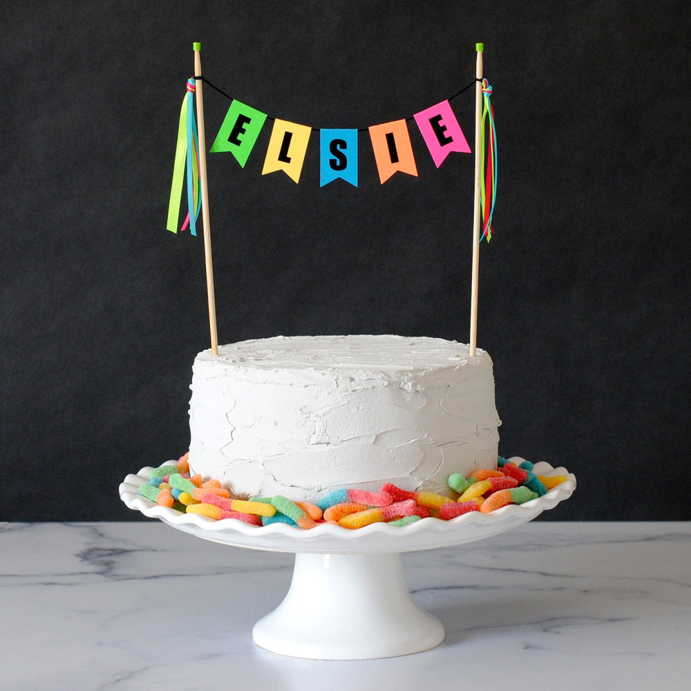birthday cake topper in bright neon colors for glow birthday party