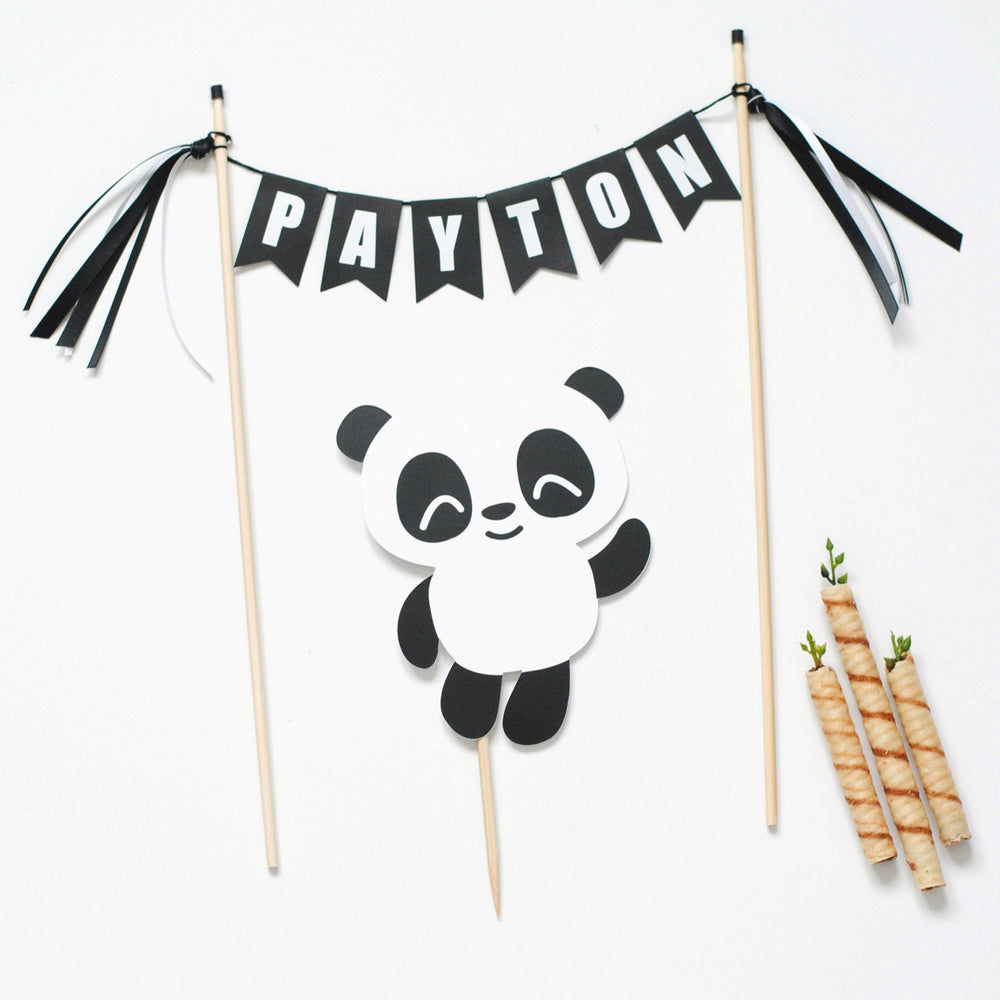 
                  
                    Panda birthday cake topper with black and white name banner and a paper panda
                  
                