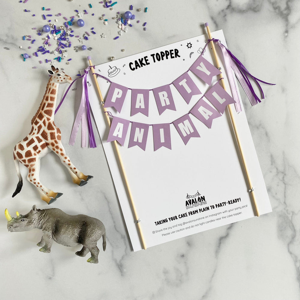 
                  
                    purple cake topper with "party animal" 
                  
                