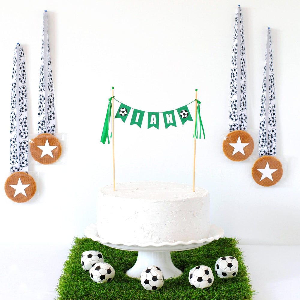 
                  
                    personalized soccer birthday cake topper with soccer ball flags on each end made by Avalon Sunshine
                  
                