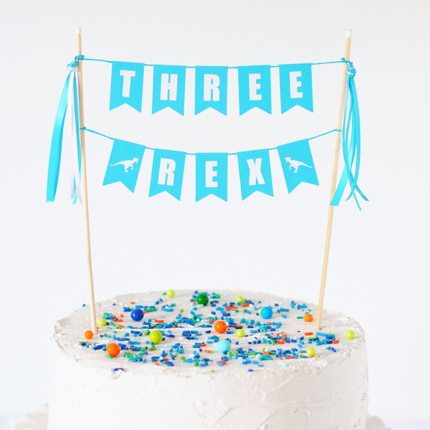 
                  
                    turquoise and white cake topper for THREE REX theme birthday party | custom cake toppers by Avalon Sunshine
                  
                