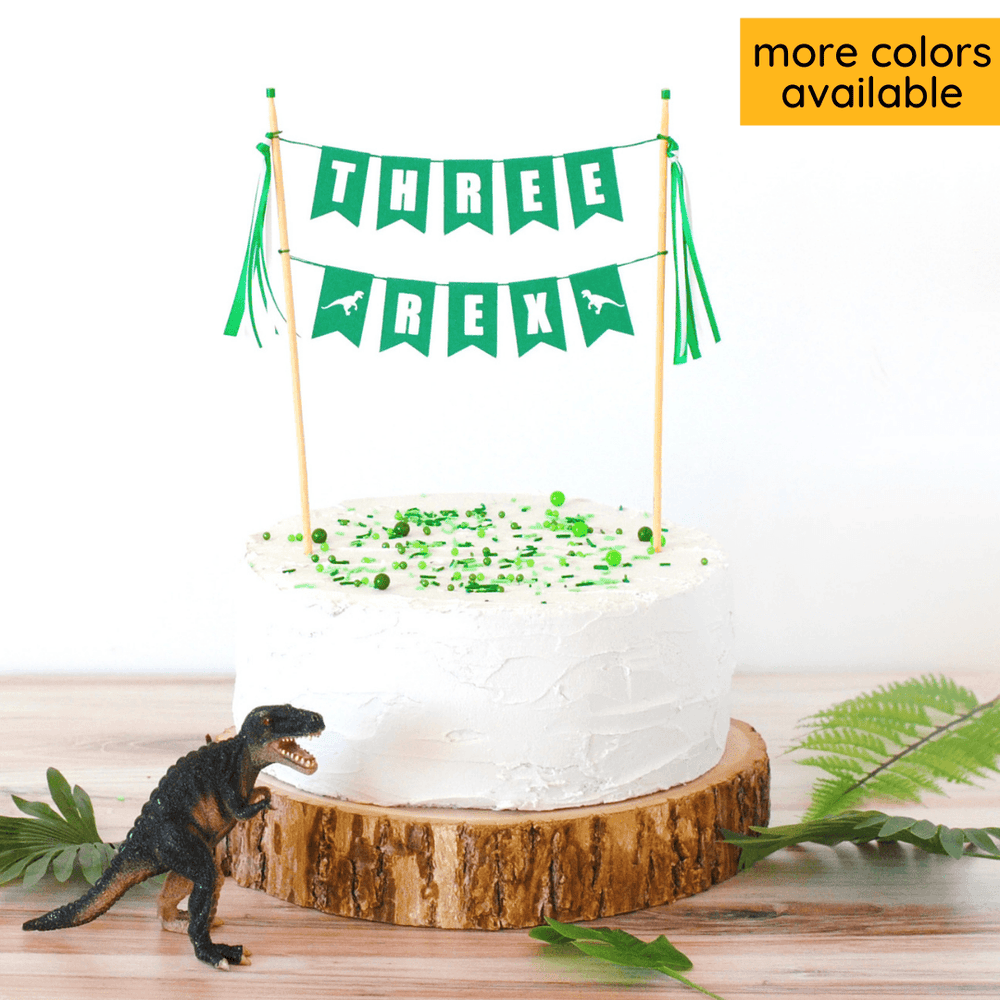 THREE REX birthday cake topper with dinosaur decorations on the table | custom cake toppers by Avalon Sunshine