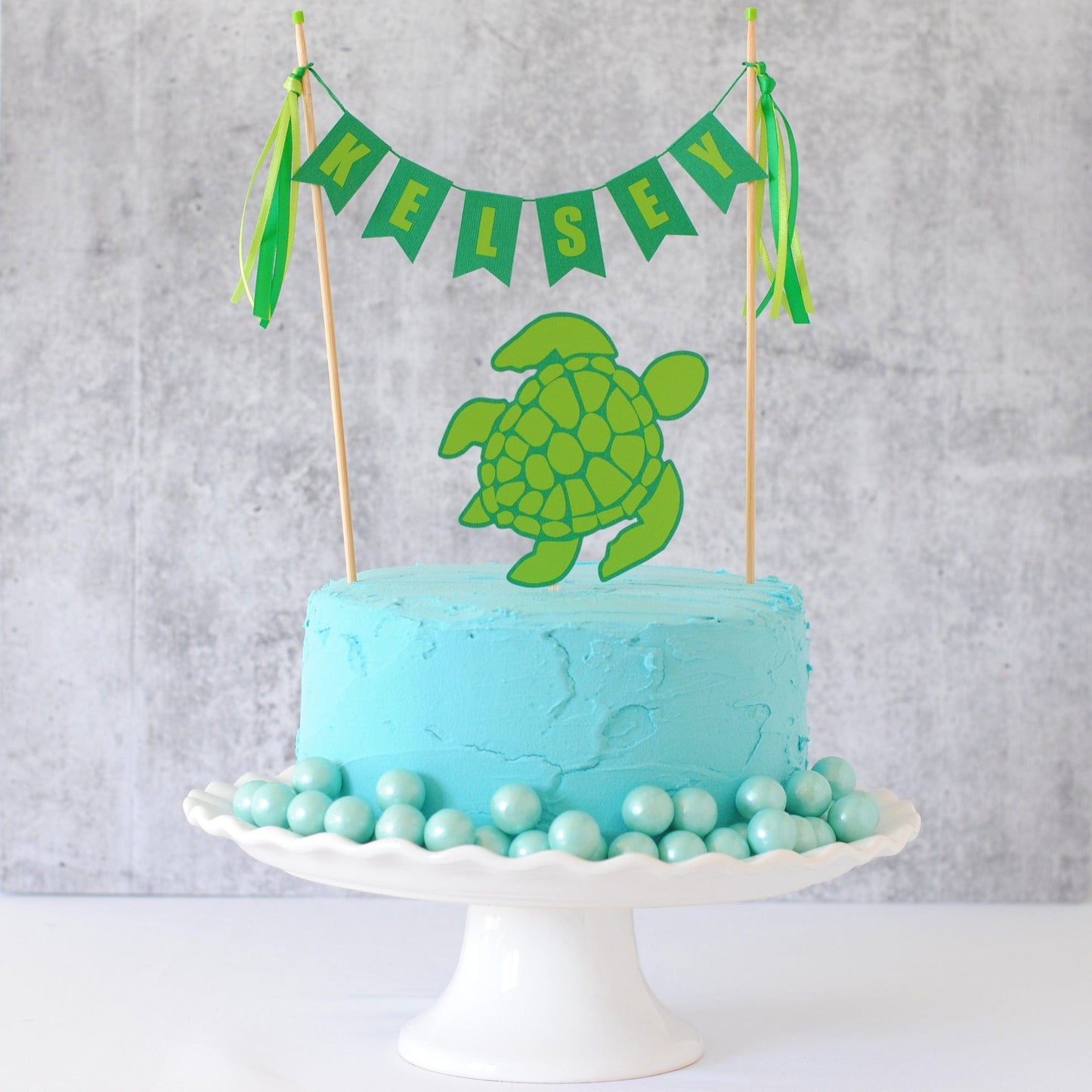 
                  
                    Sea Turtle Birthday Cake Topper set with name banner and separate turtle topper
                  
                