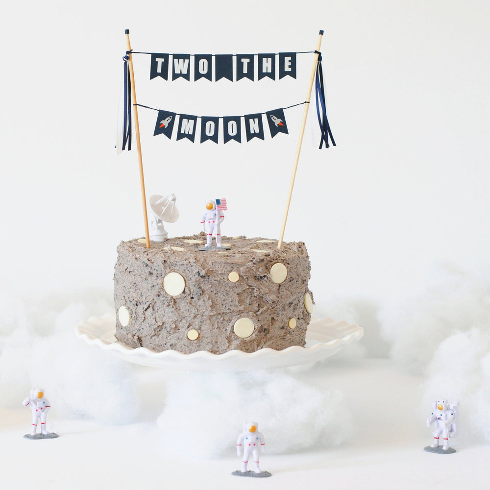 
                  
                    TWO THE MOON birthday cake styled on a moon cake with toy astronauts and clouds | Cake topper by Avalon Sunshine
                  
                