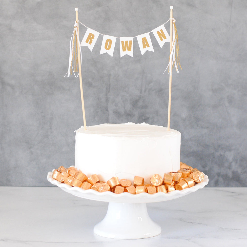 
                  
                    white and gold name banner cake topper for birthday cake
                  
                